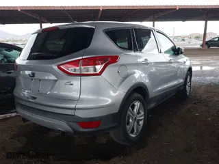 2013 Ford Escape SE with VIN 1FMCU9G96DUC86666, listed as a IAAI auction lot 41748939 with 147,452 mi miles. Bid and sale history available at carsss.com. Image 4.