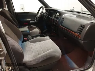 1996 Jeep Grand Cherokee Laredo with VIN 1J4GZ58S5TC182766, listed as a IAAI auction lot 41372356 with 234,390 mi miles. Bid and sale history available at carsss.com. Image 5.