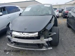 2023 Tesla Model Y Performance z VIN 7SAYGDEF6PF774965, wystawiony jako IAAI lot #41655550 z przebiegiem 33 824 mil mil oraz . Historia ofert i sprzedaży dostępna na DreamBid. Obrazek 12.