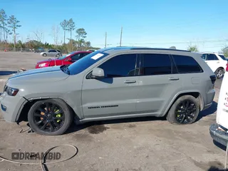 2021 Jeep Grand Cherokee Laredo E with VIN 1C4RJEAG3MC713511, listed as a IAAI auction lot 41235904 with 73,343 mi miles and . Bid and sale history available at DreamBid. Image 14.