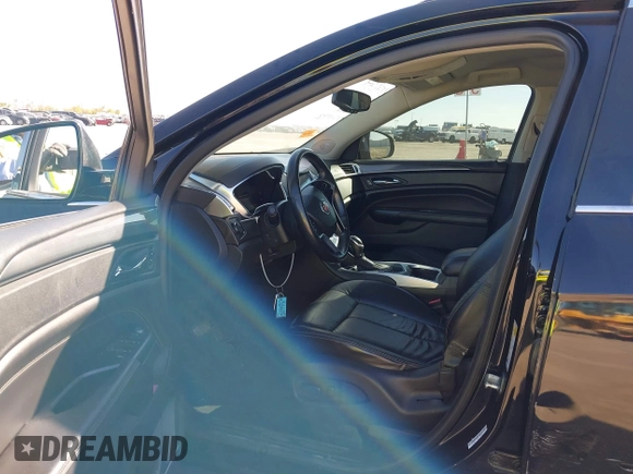 2015 Cadillac SRX with VIN 3GYFNAE30FS573125, listed as a IAAI auction lot 40972187 with 122,612 mi miles and . Bid and sale history available at DreamBid. Image 5.