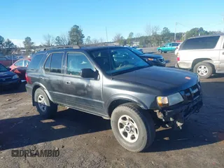 2003 Isuzu Rodeo with VIN 4S2CK58W034303195, listed as a IAAI auction lot 41219379 with 215,821 mi miles and . Bid and sale history available at DreamBid. Image 1.