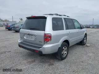 2007 Honda Pilot EX with VIN 5FNYF18457B009707, listed as a IAAI auction lot 42030214 with 229,462 mi miles. Bid and sale history available at carsss.com. Image 4.