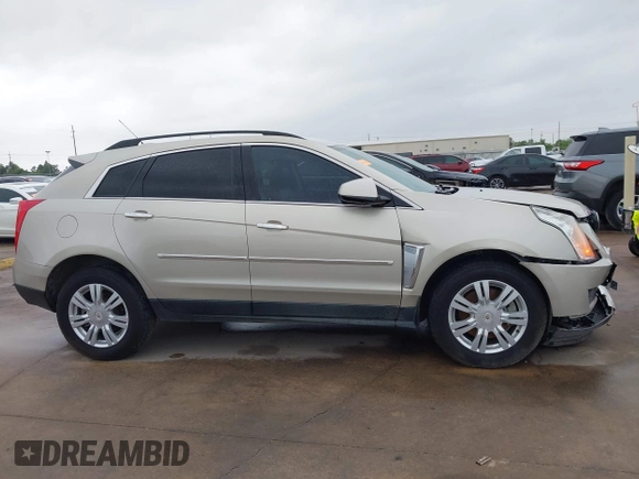 2015 Cadillac SRX z VIN 3GYFNAE37FS597695, wystawiony jako IAAI lot #42184666 z przebiegiem 106 210 mil mil oraz . Historia ofert i sprzedaży dostępna na DreamBid. Obrazek 13.