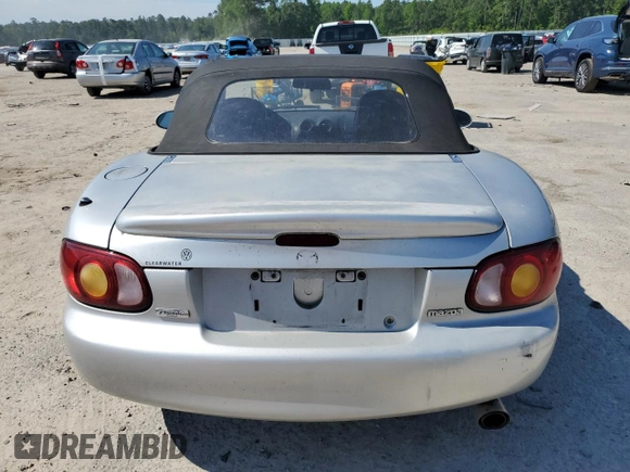 1999 Mazda MX-5 Miata z VIN JM1NB3538X0112611, wystawiony jako Copart lot #54732095 z przebiegiem 173 763 mil mil oraz Szkoda całkowita • Salvage title. Historia ofert i sprzedaży dostępna na DreamBid. Obrazek 6.