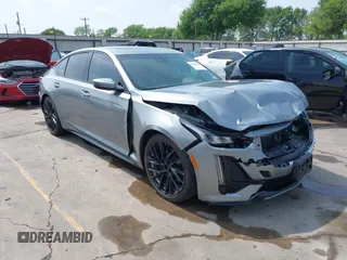 2023 Cadillac CT5 Sport z VIN 1G6DP5RK7P0113696, wystawiony jako IAAI lot #41904906 z przebiegiem 89 191 mil mil oraz . Historia ofert i sprzedaży dostępna na DreamBid. Obrazek 1.