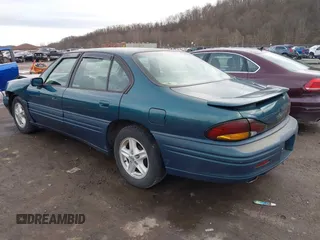 1996 Pontiac Bonneville z VIN 1G2HZ5210TH210829, wystawiony jako IAAI lot #41203888 z przebiegiem 154 990 mil mil oraz . Historia ofert i sprzedaży dostępna na DreamBid. Obrazek 3.
