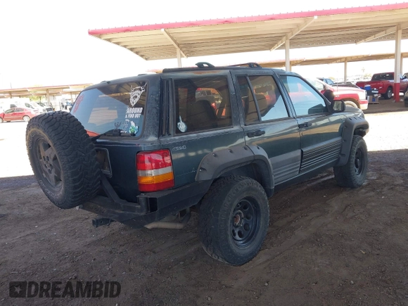 1994 Jeep Grand Cherokee Laredo with VIN 1J4GZ58S4RC280650, listed as a IAAI auction lot 42041261 with 199,265 mi miles and . Bid and sale history available at DreamBid. Image 4.