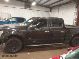 2015 Ford F-150 XLT w/HD Payload Pkg with VIN 1FTFW1EG8FFB59391, listed as a IAAI auction lot 41520010 with 119,414 mi miles. Bid and sale history available at carsss.com. Image 14.