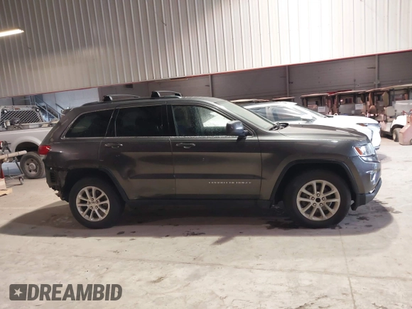 2014 Jeep Grand Cherokee Laredo with VIN 1C4RJEAG7EC145023, listed as a IAAI auction lot 40518825 with 115,098 mi miles and . Bid and sale history available at DreamBid. Image 13.