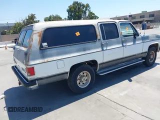 1990 GMC Suburban with VIN 1GKGR26NXLF528203, listed as a IAAI auction lot 42731684 with 185,736 mi miles and . Bid and sale history available at DreamBid. Image 4.