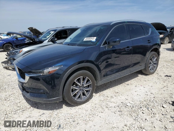 2018 Mazda CX-5 Grand Touring with VIN JM3KFBDM8J0474819, listed as a Copart auction lot 48580545 with 76,917 mi miles and Salvage Title. Bid and sale history available at DreamBid. Image 1.