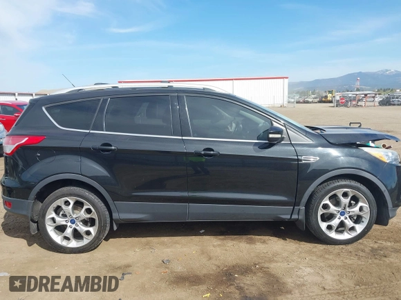 2014 Ford Escape Titanium with VIN 1FMCU9J93EUE27803, listed as a IAAI auction lot 42028249 with 131,194 mi miles and . Bid and sale history available at DreamBid. Image 12.