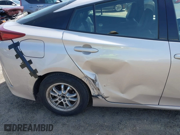2018 Toyota Prius Plus with VIN JTDKARFP5J3091877, listed as a IAAI auction lot 42129355 with 48,736 mi miles and . Bid and sale history available at DreamBid. Image 6.