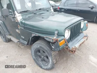 1999 Jeep Wrangler SE z VIN 1J4FY29P7XP479351, wystawiony jako IAAI lot #42797020 z przebiegiem 171 598 mil mil oraz . Historia ofert i sprzedaży dostępna na DreamBid. Obrazek 12.