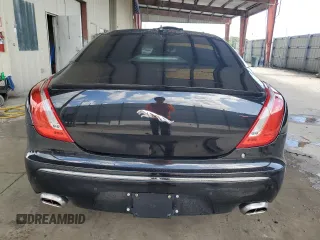2014 Jaguar XJ Portfolio z VIN SAJWA2GZ4E8V60864, wystawiony jako Copart lot #76478674 z przebiegiem 50 578 mil mil oraz Szkoda całkowita • Salvage title. Historia ofert i sprzedaży dostępna na DreamBid. Obrazek 6.