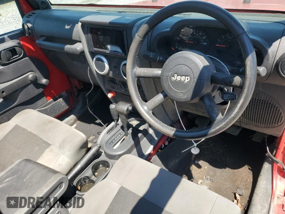 2008 Jeep Wrangler X with VIN 1J4FZ24188L607332, listed as a Copart auction lot 54507785 with 184,153 mi miles and Salvage title. Bid and sale history available at DreamBid. Image 8.