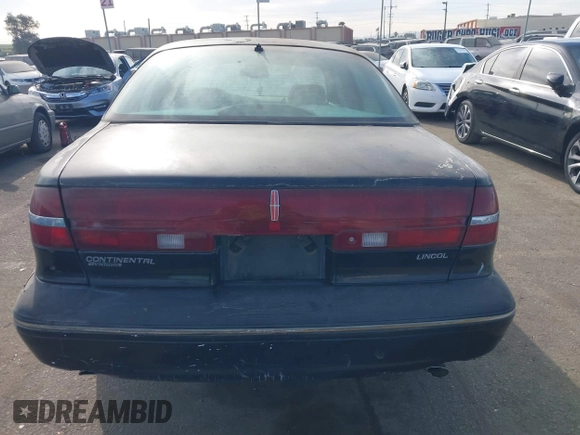1997 Lincoln Continental with VIN 1LNLM97V5VY665410, listed as a IAAI auction lot 41239128 with 66,873 mi miles. Bid and sale history available at carsss.com. Image 16.
