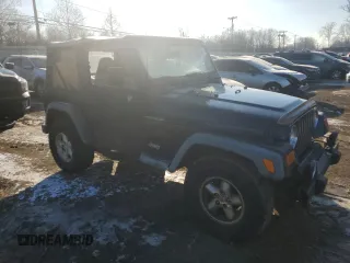 2001 Jeep Wrangler SE with VIN 1J4FA29P11P322524, listed as a Copart auction lot 42051475 with 281,929 mi miles and Clean Title. Bid and sale history available at carsss.com. Image 4.