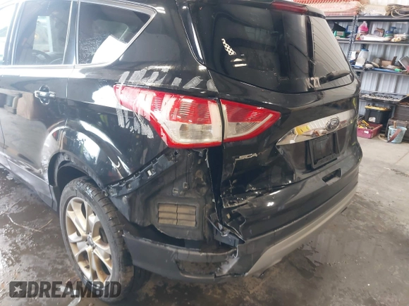 2015 Ford Escape Titanium with VIN 1FMCU9J98FUC70495, listed as a IAAI auction lot 41978543 with 129,974 mi miles. Bid and sale history available at carsss.com. Image 6.