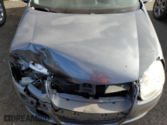 2009 Volkswagen Jetta z VIN 3VWHZ71KX9M011693, wystawiony jako Copart lot #87076904 z przebiegiem 157 478 mil mil oraz Szkoda całkowita • Salvage title. Historia ofert i sprzedaży dostępna na DreamBid. Obrazek 11.