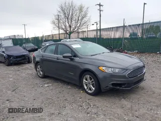 2018 Ford Fusion Hybrid SE with VIN 3FA6P0LU4JR115826, listed as a IAAI auction lot 42032209 with 195,808 mi miles. Bid and sale history available at carsss.com. Image 1.
