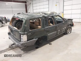 1997 Jeep Grand Cherokee Laredo z VIN 1J4GZ58YXVC729117, wystawiony jako IAAI lot #42244799 z przebiegiem Nie podano mil oraz . Historia ofert i sprzedaży dostępna na DreamBid. Obrazek 4.