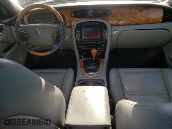 2004 Jaguar XJ with VIN SAJWA71C74SG34056, listed as a Copart auction lot 80083014 with 0 mi miles and Salvage Title. Bid and sale history available at carsss.com. Image 8.