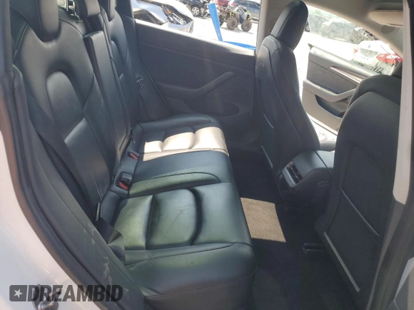 2023 Tesla Model 3 with VIN 5YJ3E1EA8PF449797, listed as a Copart auction lot 64601115 with 99,771 mi miles and Clean title. Bid and sale history available at DreamBid. Image 10.