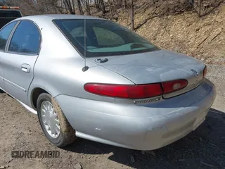 1999 Mercury Sable LS z VIN 1MEFM53S7XA622932, wystawiony jako IAAI lot #41708531 z przebiegiem 155 702 mil mil oraz . Historia ofert i sprzedaży dostępna na DreamBid. Obrazek 12.