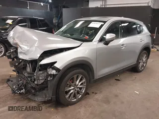 2021 Mazda CX-5 Grand Touring with VIN JM3KFBDM7M1392644, listed as a IAAI auction lot 41824612 with 80,000 mi miles and . Bid and sale history available at DreamBid. Image 16.