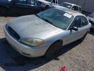 2005 Ford Taurus SE with VIN 1FAFP53U85A117320, listed as a IAAI auction lot 42121647 with 179,434 mi miles. Bid and sale history available at carsss.com. Image 2.