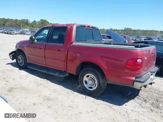 2001 Ford F-150 SuperCrew XLT with VIN 1FTRW07L11KE20412, listed as a IAAI auction lot 41877980 with 1 mi miles. Bid and sale history available at carsss.com. Image 3.