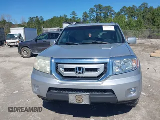 2011 Honda Pilot Touring with VIN 5FNYF4H91BB086712, listed as a IAAI auction lot 41809369 with 260,718 mi miles. Bid and sale history available at carsss.com. Image 12.