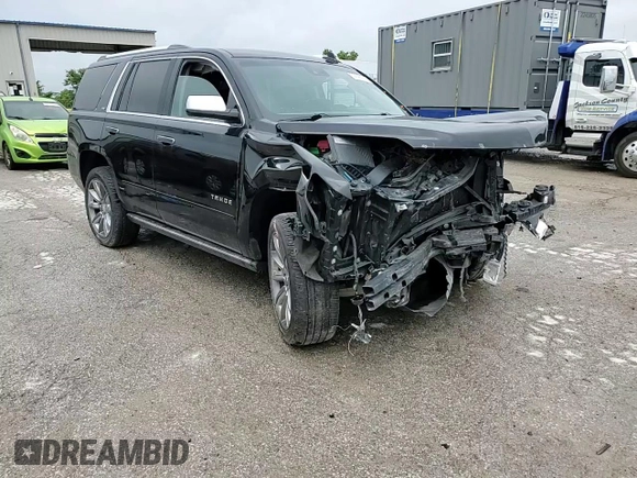 2015 Chevrolet Tahoe LTZ z VIN 1GNSKCKC8FR506151, wystawiony jako Copart lot #59948174 z przebiegiem Nie podano mil oraz Szkoda całkowita • Salvage title. Historia ofert i sprzedaży dostępna na DreamBid. Obrazek 11.