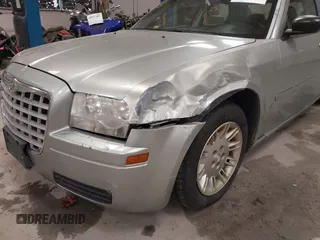2005 Chrysler 300 with VIN 2C3JA43R55H569369, listed as a IAAI auction lot 41132751 with 123,253 mi miles. Bid and sale history available at carsss.com. Image 6.