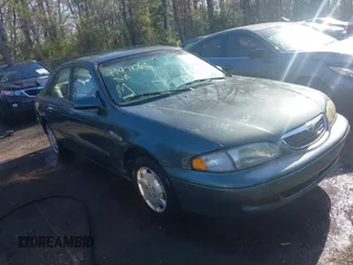 1998 Mazda 626 DX with VIN 1YVGF22C4W5768778, listed as a IAAI auction lot 41971066 with 119,168 mi miles. Bid and sale history available at carsss.com. Image 1.