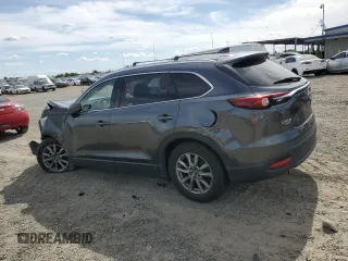 2019 Mazda CX-9 Touring with VIN JM3TCBCY0K0309947, listed as a Copart auction lot 56897815 with 87,517 mi miles and Salvage title. Bid and sale history available at DreamBid. Image 2.