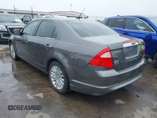 2012 Ford Fusion Hybrid z VIN 3FADP0L33CR289548, wystawiony jako IAAI lot #41905806 z przebiegiem 121 233 mil mil oraz . Historia ofert i sprzedaży dostępna na DreamBid. Obrazek 3.