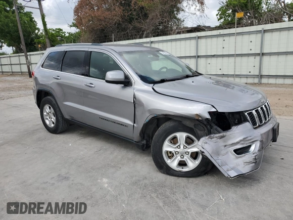 2017 Jeep Grand Cherokee Laredo with VIN 1C4RJEAG0HC664063, listed as a Copart auction lot 54850295 with 82,913 mi miles and Salvage title. Bid and sale history available at DreamBid. Image 4.