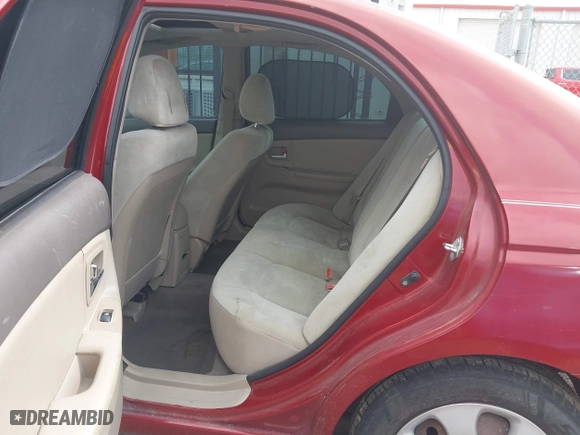 2009 Kia Spectra EX with VIN KNAFE221195606045, listed as a IAAI auction lot 42128548 with 124,577 mi miles. Bid and sale history available at carsss.com. Image 8.
