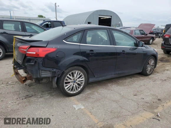 2017 Ford Focus Titanium with VIN 1FADP3J23HL218867, listed as a Copart auction lot 55417305 with 98,710 mi miles and Salvage title. Bid and sale history available at DreamBid. Image 3.