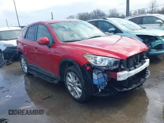 2015 Mazda CX-5 Grand Touring with VIN JM3KE4DY7F0477770, listed as a IAAI auction lot 41617849 with 106,135 mi miles. Bid and sale history available at carsss.com. Image 1.