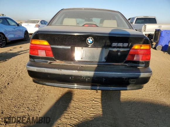 1999 BMW 5 Series 528iA with VIN WBADM634XXGU02243, listed as a Copart auction lot 74981184 with 234,566 mi miles and Salvage Title. Bid and sale history available at carsss.com. Image 6.