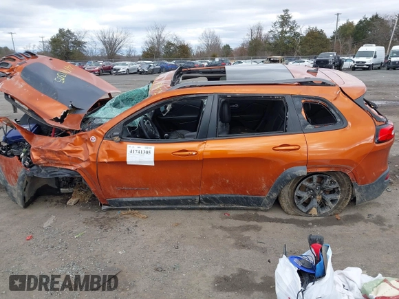 2015 Jeep Cherokee Trailhawk z VIN 1C4PJMBS9FW750858, wystawiony jako IAAI lot #41741305 z przebiegiem Nie podano mil oraz . Historia ofert i sprzedaży dostępna na DreamBid. Obrazek 14.
