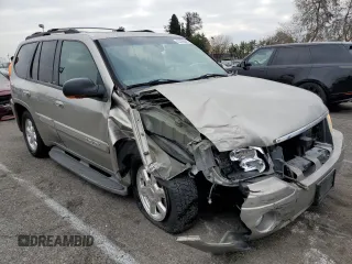 2003 GMC Envoy SLE with VIN 1GKDS13S232236886, listed as a Copart auction lot 43220545 with 58,229 mi miles and Salvage Title. Bid and sale history available at carsss.com. Image 4.