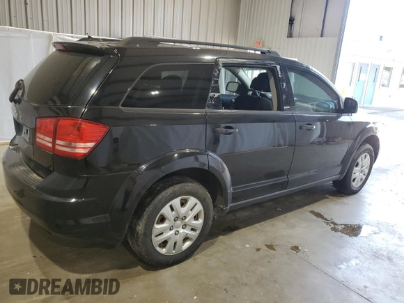 2017 Dodge Journey SE with VIN 3C4PDCABXHT506356, listed as a Copart auction lot 52409805 with 146,782 mi miles and Salvage Title. Bid and sale history available at DreamBid. Image 3.