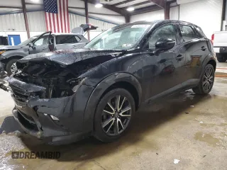 2018 Mazda CX-3 Touring z VIN JM1DKFC75J0301307, wystawiony jako Copart lot #56302175 z przebiegiem 107 676 mil mil oraz Szkoda całkowita • Salvage title. Historia ofert i sprzedaży dostępna na DreamBid. Obrazek 1.