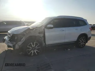 2020 Honda Pilot Touring 8-Passenger with VIN 5FNYF5H97LB009821, listed as a Copart auction lot 70979274 with 70,322 mi miles and Salvage Title. Bid and sale history available at DreamBid. Image 1.