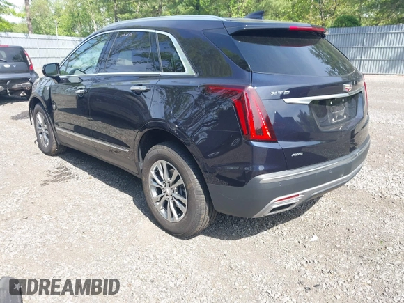 2021 Cadillac XT5 AWD Premium Luxury z VIN 1GYKNDRS8MZ217572, wystawiony jako IAAI lot #42190571 z przebiegiem 25 100 mil mil oraz . Historia ofert i sprzedaży dostępna na DreamBid. Obrazek 3.